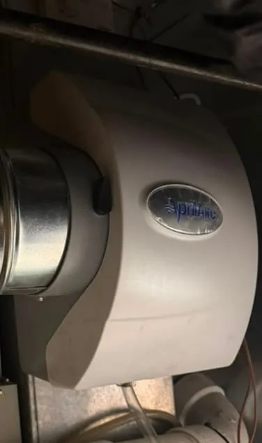 Aprilaire whole-home humidifier installed by Lucas Heating and Air on furnace ductwork in North Salt Lake