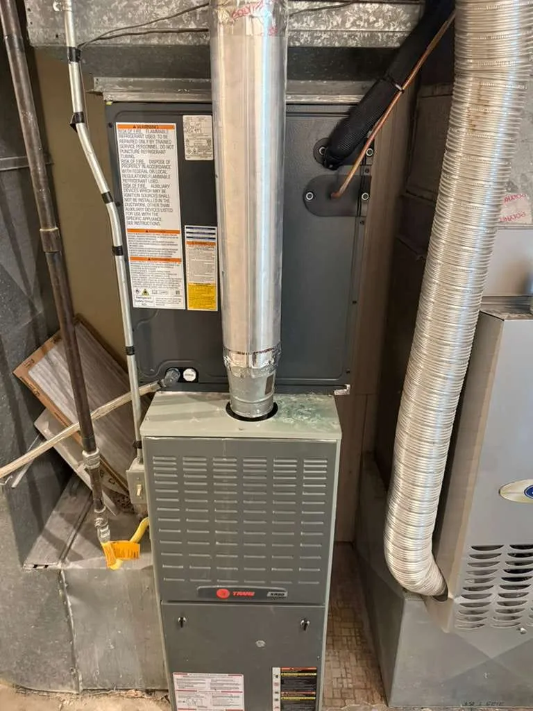 New AC evaporator coil installed by Lucas Heating and Air on an existing Trane XR80 furnace in a West Jordan mechanical room