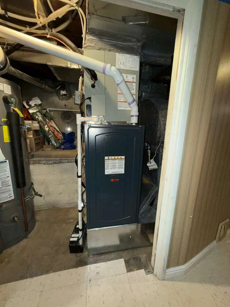 New Trane high-efficiency furnace installed by Lucas Heating and Air in a Salt Lake City basement, with PVC venting